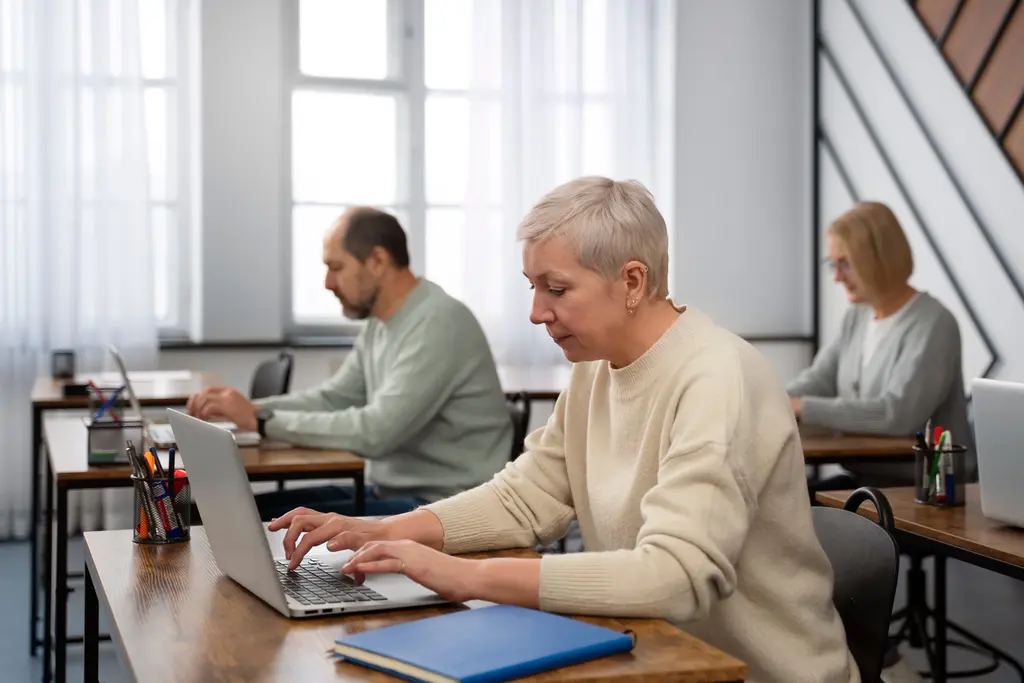Executivos estudando sobre cultura de aprendizagem e Lifelong Learning em escolas de neg&oacute;cios.